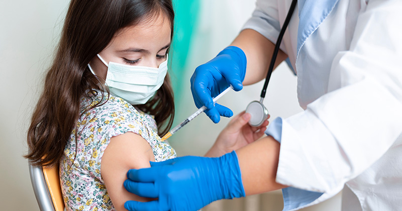 A3 - Child receiving a vaccination.