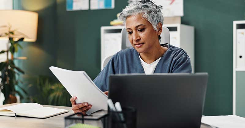 doctor seeing laptop with docs