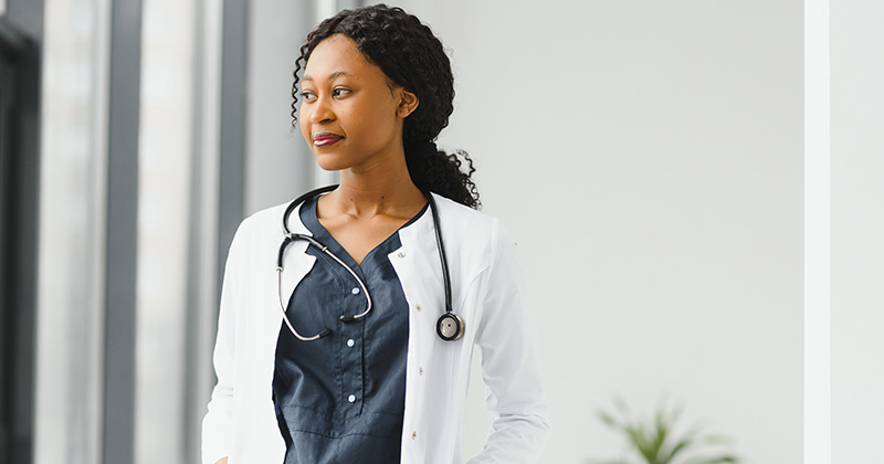 female doctor looks out of window