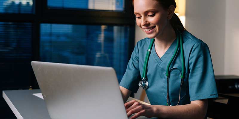 medical staff working with laptop