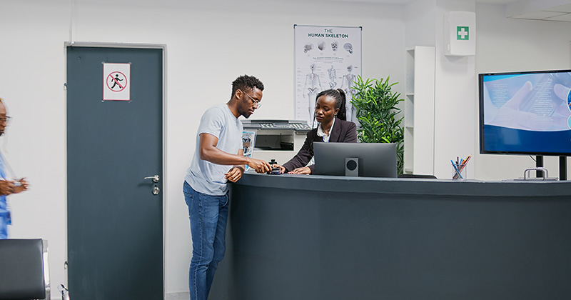 PATIENT PAYING AT DESK