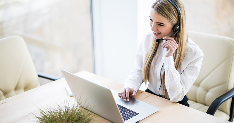 WOMAN TALKING INTO HEADSET